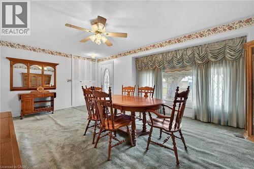 Carpeted dining space with ceiling fan and baseboards - 21 Bluebird Avenue, Hamilton, ON - Indoor Photo Showing Dining Room