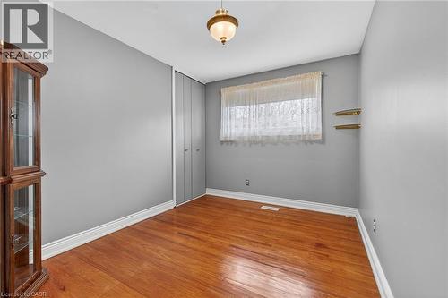 Unfurnished room with light wood-style flooring and baseboards - 21 Bluebird Avenue, Hamilton, ON - Indoor Photo Showing Other Room