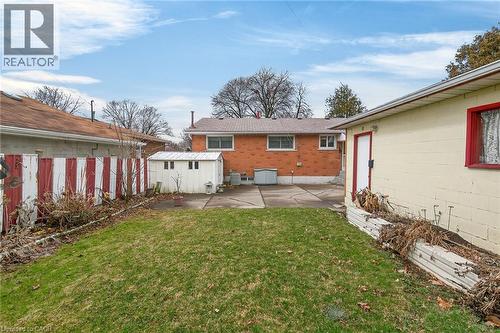 Rear view of house featuring a patio and a storage shed - 21 Bluebird Avenue, Hamilton, ON 