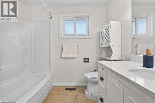 Bathroom featuring vanity, light tile patterned floors, and  shower combination - 146 Appalachian Crescent Unit# Upper, Kitchener, ON - Indoor Photo Showing Bathroom