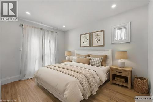 Bedroom featuring light wood-type flooring and recessed lighting - 129 Jackson Street W, Hamilton, ON - Indoor Photo Showing Bedroom