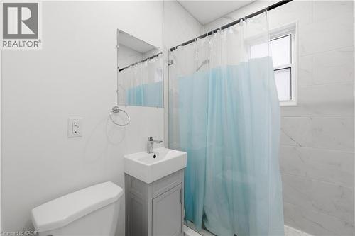 Bathroom with vanity and a stall shower - 129 Jackson Street W, Hamilton, ON - Indoor Photo Showing Bathroom