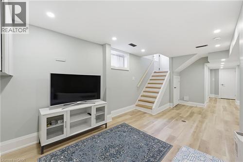 Living area featuring light wood-style flooring and recessed lighting - 129 Jackson Street W, Hamilton, ON - Indoor