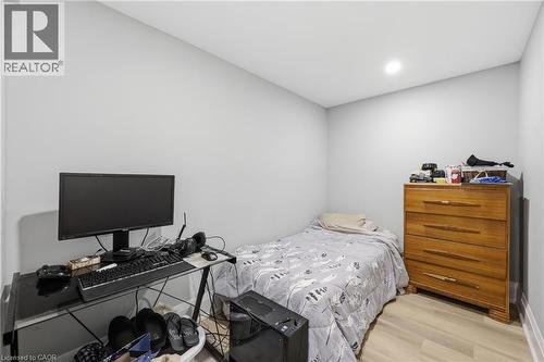 Bedroom with light wood-type flooring and recessed lighting - 129 Jackson Street W, Hamilton, ON - Indoor Photo Showing Bedroom