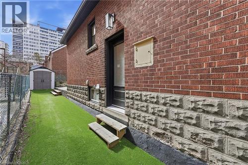 Property entrance with brick siding - 129 Jackson Street W, Hamilton, ON - Outdoor With Exterior