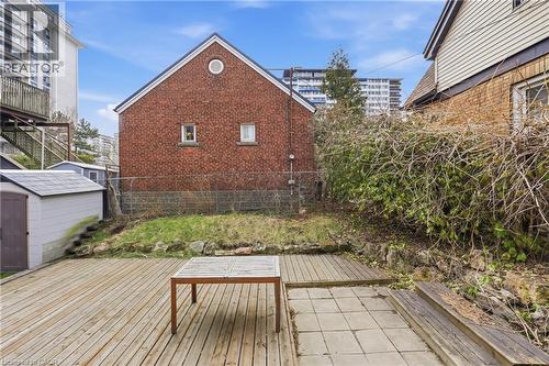 Wooden deck with a storage unit - 129 Jackson Street W, Hamilton, ON - Outdoor
