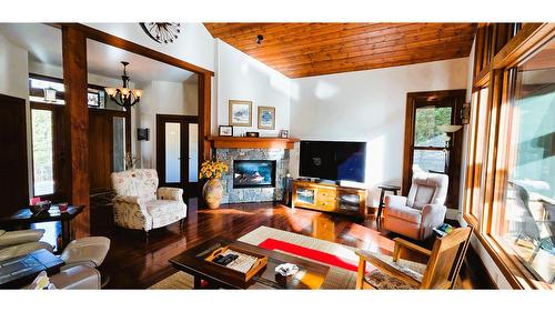5962 Wolf Creek Road, Wasa, BC - Indoor Photo Showing Living Room With Fireplace