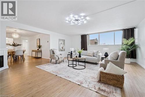 93 Westwood Road Unit# 607, Guelph, ON - Indoor Photo Showing Living Room With Fireplace