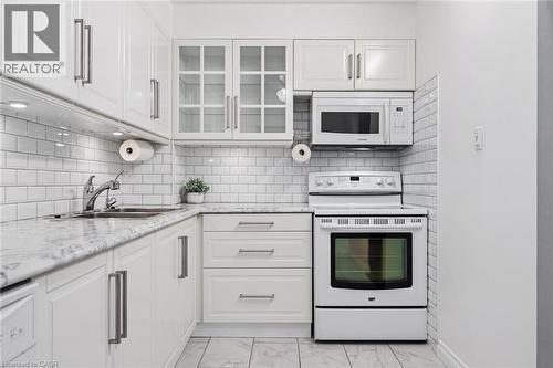 93 Westwood Road Unit# 607, Guelph, ON - Indoor Photo Showing Kitchen With Double Sink