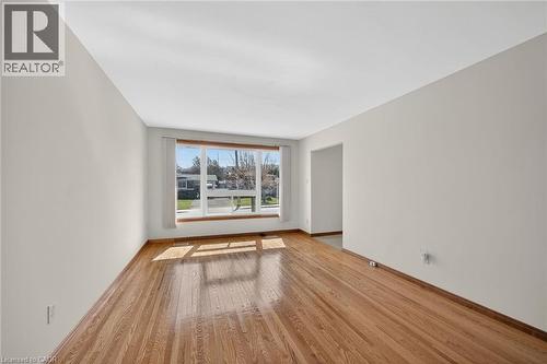 Unfurnished room featuring light wood finished floors and baseboards - 122 Glen Forest Drive, Hamilton, ON - Indoor