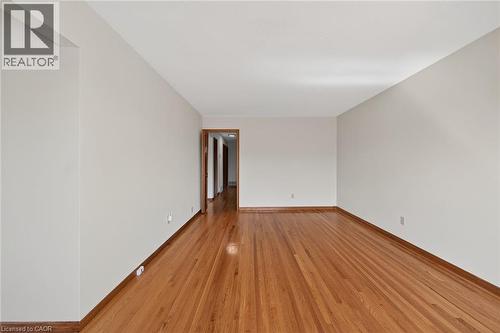 Spare room with light wood-style floors and baseboards - 122 Glen Forest Drive, Hamilton, ON - Indoor Photo Showing Other Room