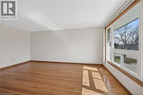 Spare room with light wood-style floors and baseboards - 122 Glen Forest Drive, Hamilton, ON - Indoor Photo Showing Other Room