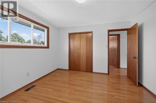 Unfurnished bedroom featuring light wood finished floors and a closet - 122 Glen Forest Drive, Hamilton, ON - Indoor Photo Showing Other Room