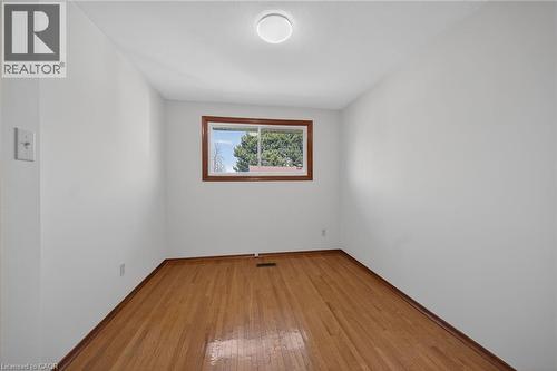 Empty room with light wood-style floors and baseboards - 122 Glen Forest Drive, Hamilton, ON - Indoor Photo Showing Other Room