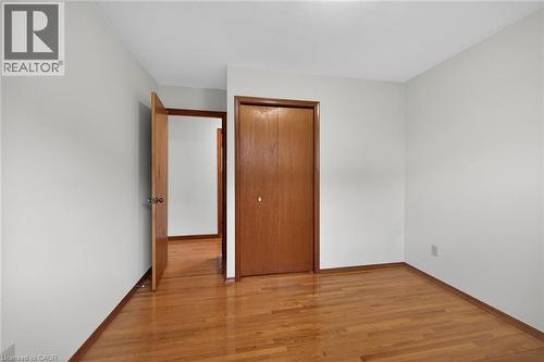 Unfurnished bedroom with light wood-type flooring and a closet - 122 Glen Forest Drive, Hamilton, ON - Indoor Photo Showing Other Room