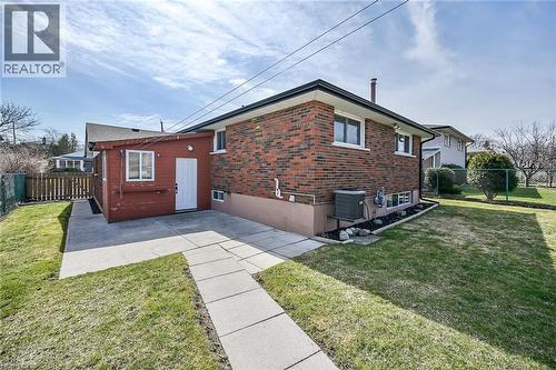 View of property exterior with a fenced backyard, a patio, and brick siding - 122 Glen Forest Drive, Hamilton, ON - Outdoor With Exterior