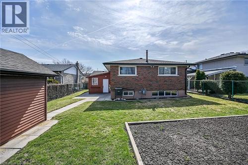 Rear view of property with brick siding, a fenced backyard, and a patio - 122 Glen Forest Drive, Hamilton, ON - Outdoor