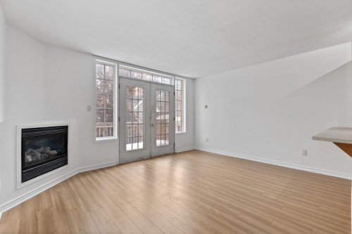 Living Room - B-325 Rue Champlain, Gatineau (Hull), QC - Indoor With Fireplace