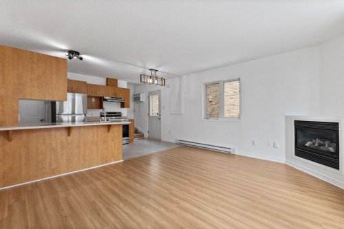 Living Room - B-325 Rue Champlain, Gatineau (Hull), QC - Indoor Photo Showing Kitchen With Fireplace
