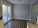 Spare room with dark wood-style flooring and baseboards - 593 Mount Anne Drive, Waterloo, ON  - Indoor Photo Showing Other Room 