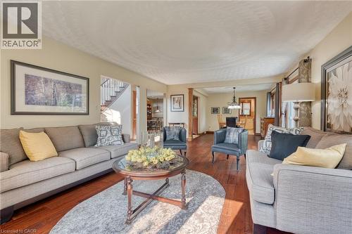 Living room featuring a chandelier and dark wood-style floors - 15 Marquette Drive, Kitchener, ON - Indoor Photo Showing Living Room