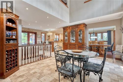 Dining space with recessed lighting, plenty of natural light, light stone finish flooring, and a high ceiling - 15 Marquette Drive, Kitchener, ON - Indoor Photo Showing Dining Room