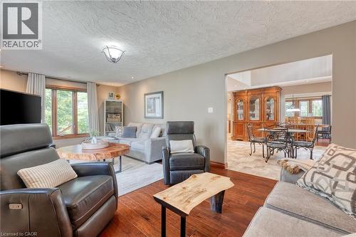 Living room featuring a textured ceiling and wood finished floors - 15 Marquette Drive, Kitchener, ON - Indoor Photo Showing Living Room