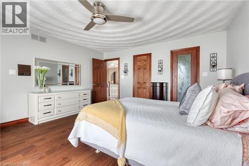 Bedroom featuring a ceiling fan and dark wood-style flooring - 15 Marquette Drive, Kitchener, ON - Indoor Photo Showing Bedroom
