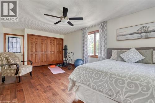 Bedroom featuring dark wood finished floors, ceiling fan, and a closet - 15 Marquette Drive, Kitchener, ON - Indoor Photo Showing Bedroom