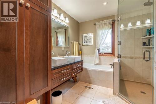 Bathroom featuring double vanity, light tile patterned floors, a shower stall, and a bath - 15 Marquette Drive, Kitchener, ON - Indoor Photo Showing Bathroom