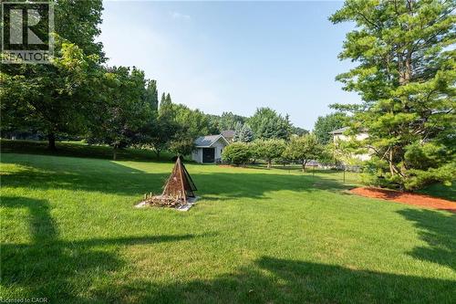 View of green lawn with view of wooded area - 15 Marquette Drive, Kitchener, ON - Outdoor