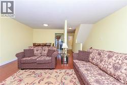 Living room with wood finished floors and baseboards - 