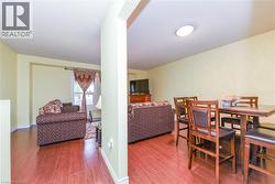 Dining area featuring wood finished floors and baseboards - 