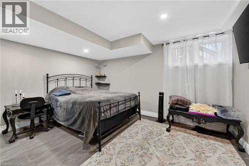 Bedroom featuring light wood-style floors and recessed lighting - 7809 Hackberry Trail E, Niagara Falls, ON - Indoor Photo Showing Bedroom