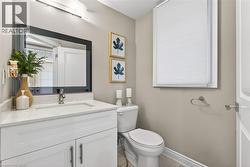 Bathroom featuring vanity and light tile patterned floors - 
