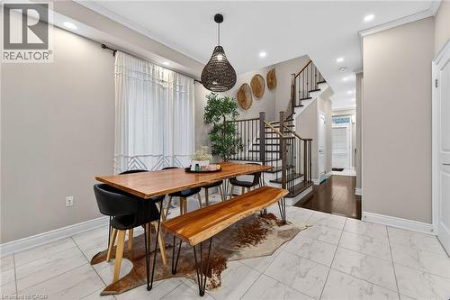 Dining room featuring light marble finish floors, recessed lighting, and ornamental molding - 7809 Hackberry Trail E, Niagara Falls, ON - Indoor Photo Showing Other Room