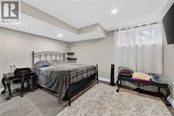 Bedroom featuring light wood-style floors and recessed lighting - 
