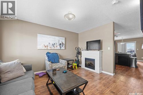 411 3826 Dewdney Avenue E, Regina, SK - Indoor Photo Showing Living Room With Fireplace