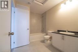 Bathroom with vanity and shower / tub combination - 