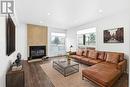 This photo has been virtually staged. - 311 Presland Road, Ottawa, ON  - Indoor Photo Showing Living Room With Fireplace 