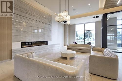 207 - 8960 Jane Street, Vaughan, ON - Indoor Photo Showing Living Room With Fireplace