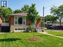 View of front of home featuring a front lawn, stone siding, and brick siding - 1224 Dunsmure Road, Hamilton, ON  - Outdoor 
