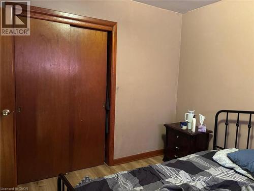 Bedroom with light wood-style floors and a closet - 1224 Dunsmure Road, Hamilton, ON - Indoor Photo Showing Bedroom