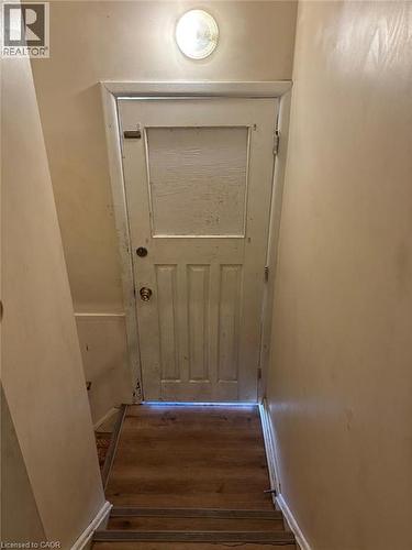 Doorway to outside featuring hardwood / wood-style flooring - 1224 Dunsmure Road, Hamilton, ON - Indoor Photo Showing Other Room