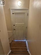 Doorway to outside featuring hardwood / wood-style flooring - 