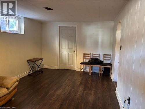 Sitting room featuring dark wood-style flooring and arched walkways - 1224 Dunsmure Road, Hamilton, ON - Indoor Photo Showing Other Room