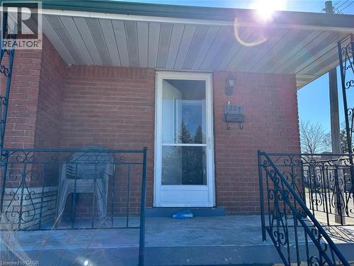 Property entrance with brick siding - 1224 Dunsmure Road, Hamilton, ON - Outdoor With Exterior