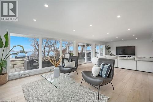 Living room with light wood-style floors and recessed lighting - 624 North Shore Boulevard E, Burlington, ON - Indoor Photo Showing Living Room