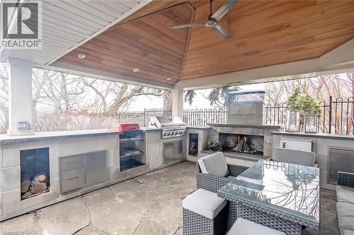 View of patio with an outdoor fireplace, an outdoor kitchen / dining area, and ceiling fan - 624 North Shore Boulevard E, Burlington, ON -  Photo Showing Other Room