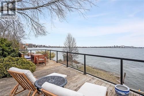 Deck with a fire pit and a water view - 624 North Shore Boulevard E, Burlington, ON - Outdoor With Body Of Water With Balcony